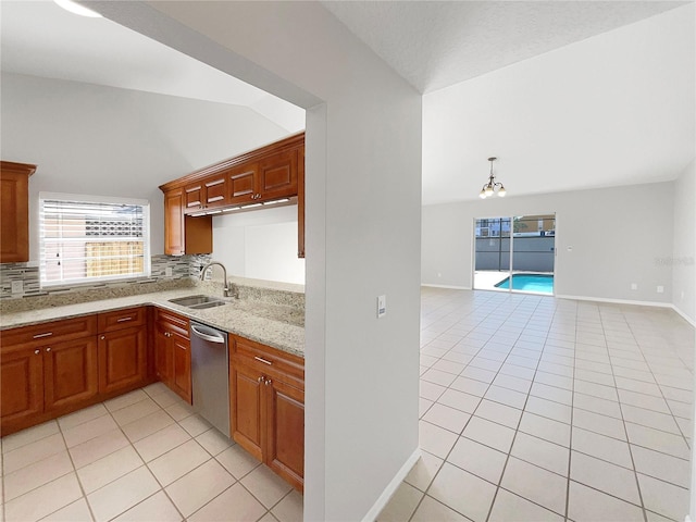 kitchen featuring dishwasher, an inviting chandelier, sink, and light tile floors