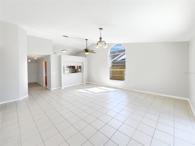 unfurnished living room featuring lofted ceiling, light tile floors, and ceiling fan with notable chandelier