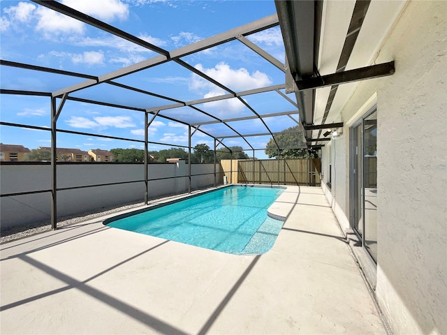 view of pool featuring a patio and a lanai