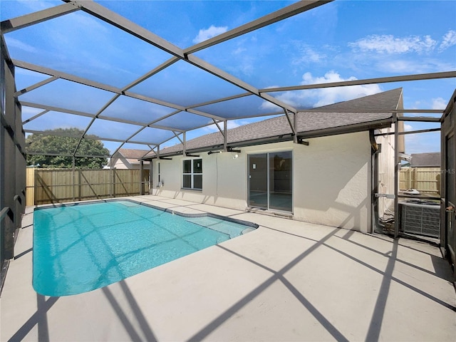 view of swimming pool with a lanai and a patio area