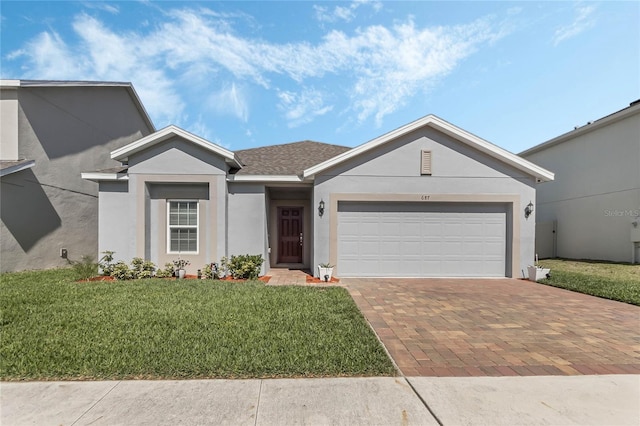 ranch-style home featuring a front yard and a garage