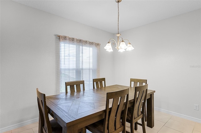 687 Campo Ln, Davenport, FL 33837 - dining room with a chandelier and light tile patterned floors