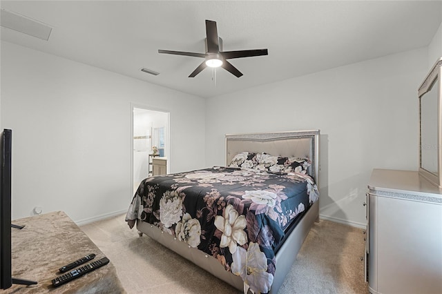 687 Campo Ln, Davenport, FL 33837 - bedroom with light colored carpet, ceiling fan, and ensuite bathroom
