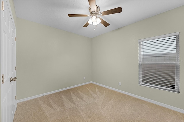 687 Campo Ln, Davenport, FL 33837 - empty room with light colored carpet and a ceiling fan