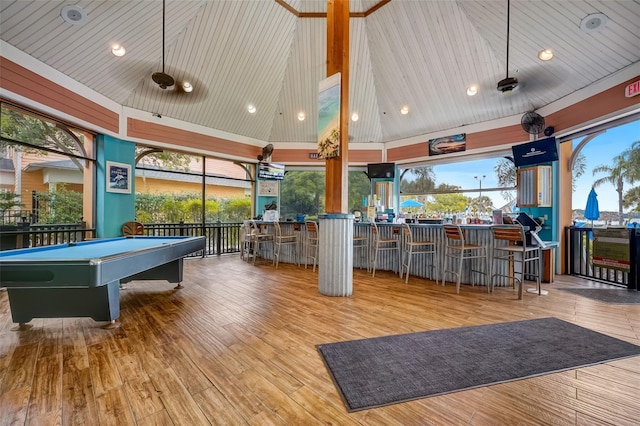 game room with light hardwood / wood-style flooring, high vaulted ceiling, billiards, indoor bar, and wood ceiling