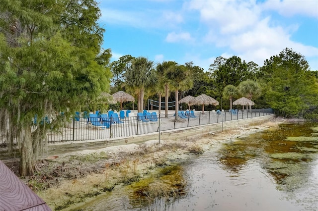 view of jungle gym with a water view