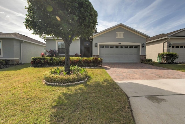 single story home featuring a garage and a front lawn