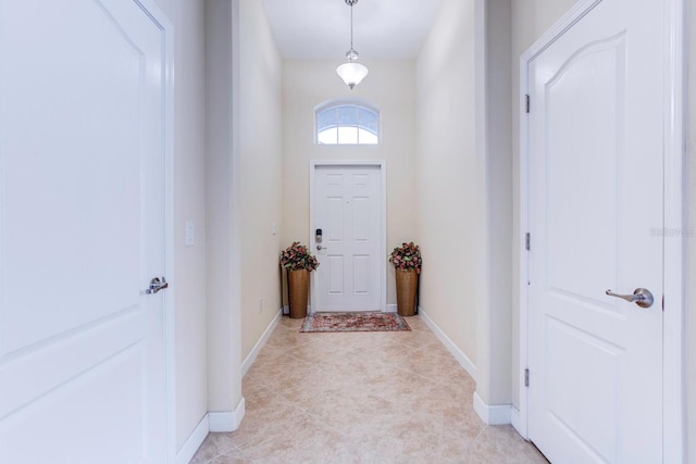 entryway featuring light tile floors