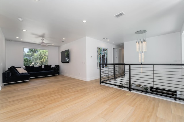 interior space with light hardwood / wood-style flooring and a chandelier