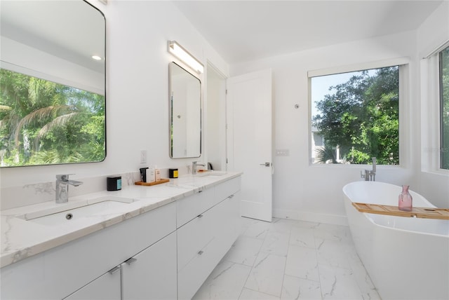 bathroom featuring double sink, tile floors, a bathtub, and oversized vanity