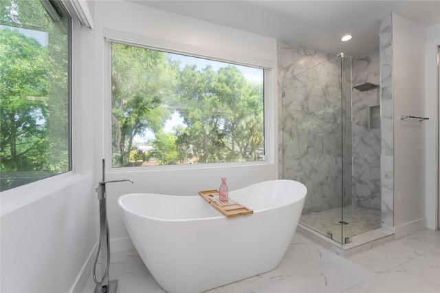 bathroom featuring tile floors and independent shower and bath