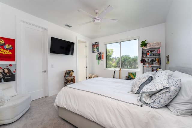 carpeted bedroom with ceiling fan