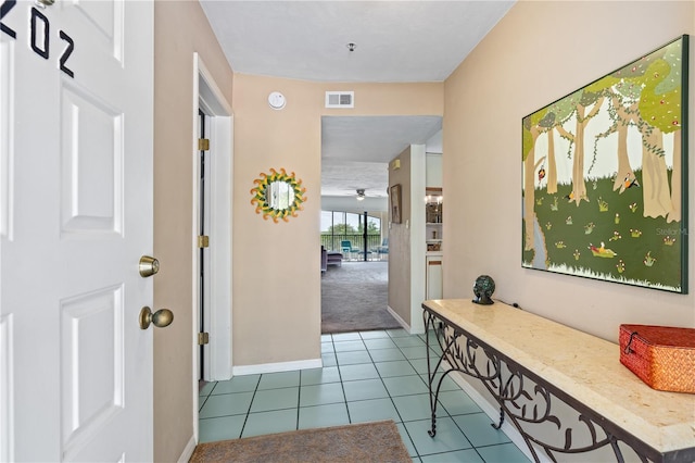 entryway with light carpet