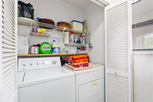 laundry area with washing machine and clothes dryer