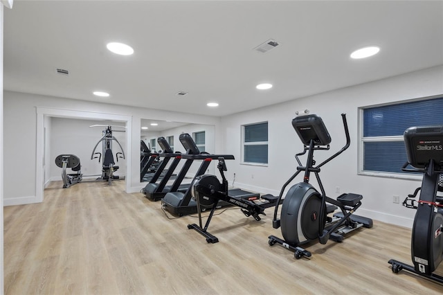 exercise area with light hardwood / wood-style floors