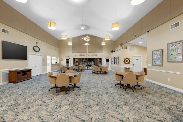 living room featuring high vaulted ceiling
