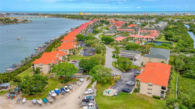 birds eye view of property featuring a water view