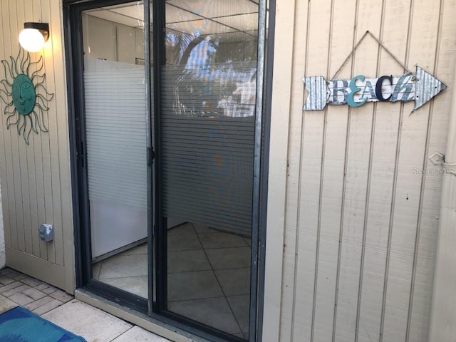 exterior details featuring light tile flooring