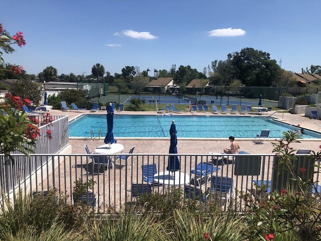 view of swimming pool with a patio area