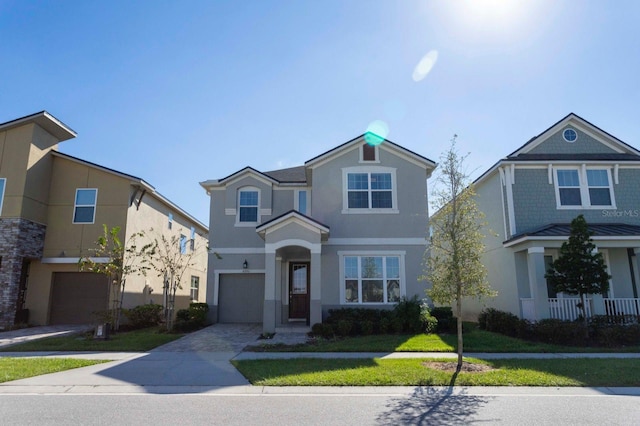 view of front facade with a front lawn and a garage