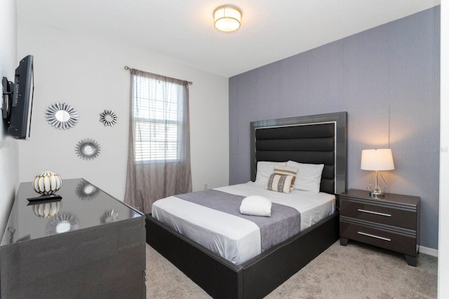 bedroom with light colored carpet