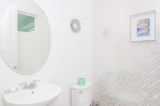 bathroom with toilet and sink