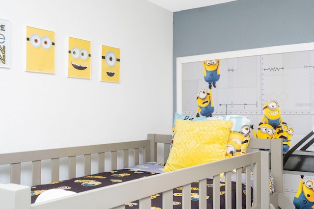 bedroom with a nursery area