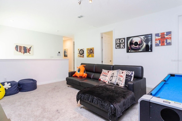 living room with light carpet and pool table