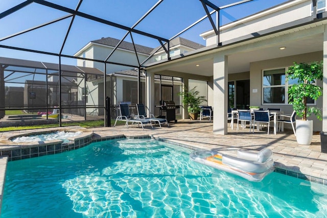 view of pool with a grill, an in ground hot tub, glass enclosure, and a patio