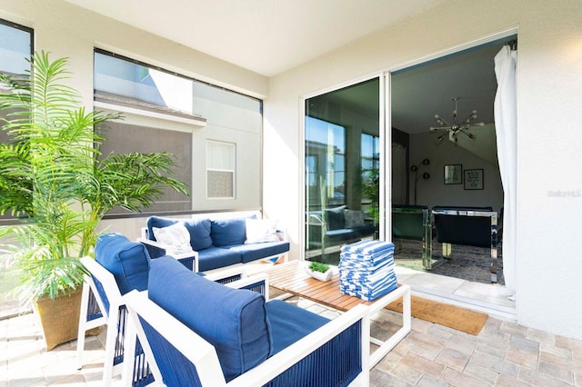 view of patio with outdoor lounge area and ceiling fan