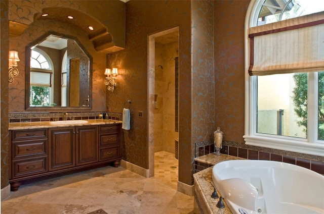 bathroom with plus walk in shower, vanity, and tile flooring