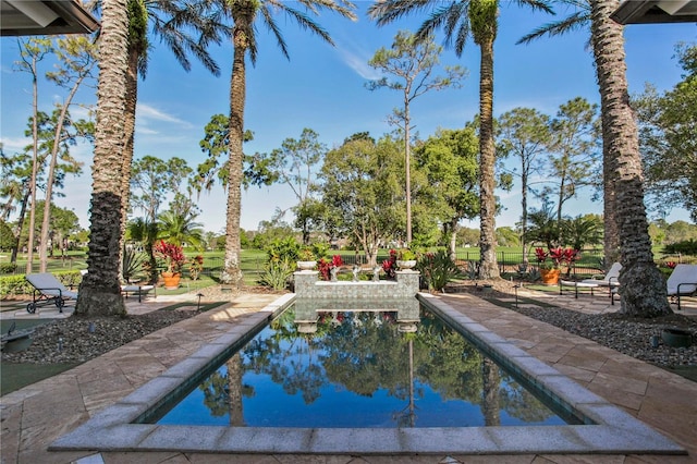 view of swimming pool with a patio area