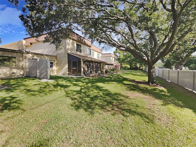 view of yard featuring a sunroom