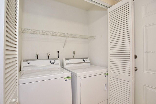 clothes washing area with hookup for an electric dryer and separate washer and dryer