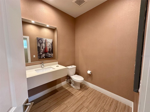 bathroom featuring oversized vanity and toilet