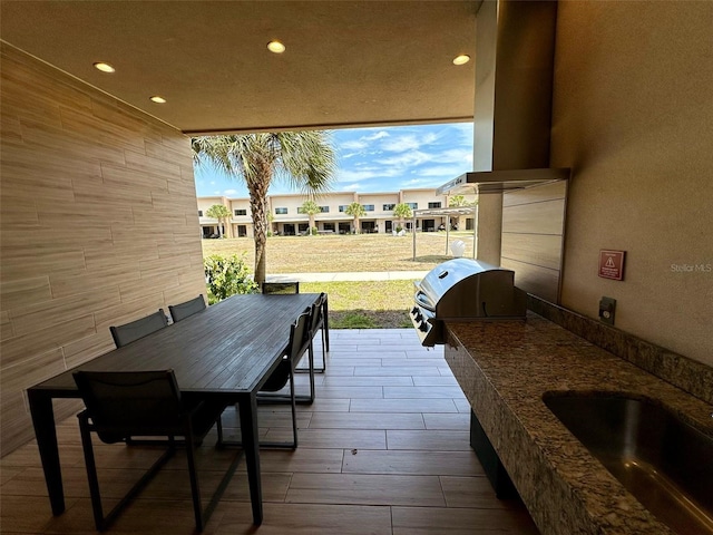 view of terrace featuring a grill and sink