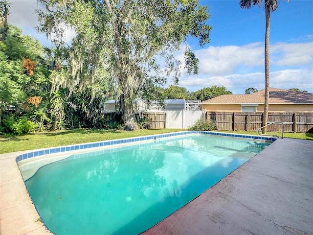 view of swimming pool with a fenced backyard and a fenced in pool