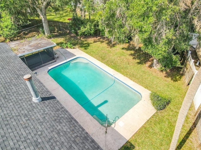 view of swimming pool with a lawn, a patio area, a fenced backyard, and a fenced in pool