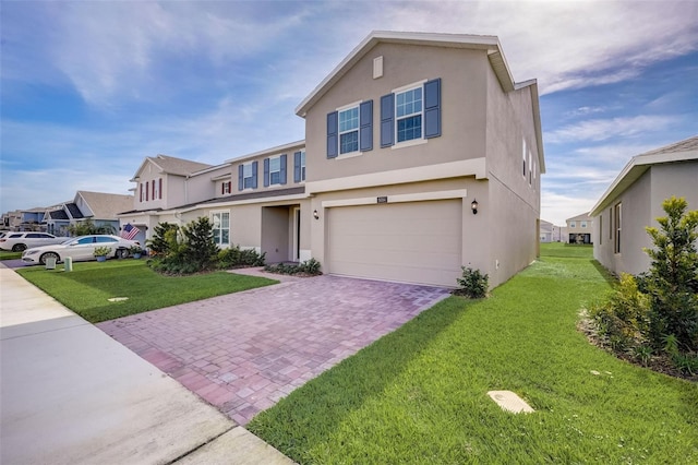 view of front of home with a garage and a front yard