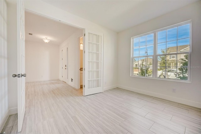 empty room featuring french doors