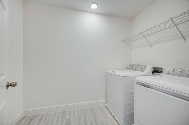 laundry room with separate washer and dryer and washer hookup