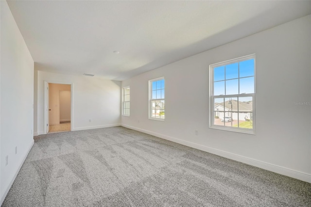 empty room featuring light colored carpet