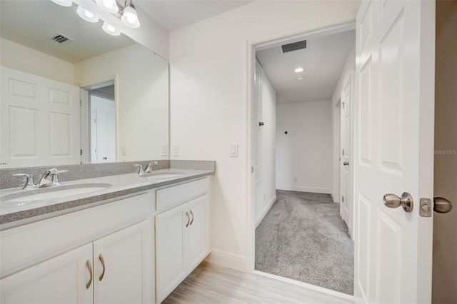 bathroom featuring dual bowl vanity