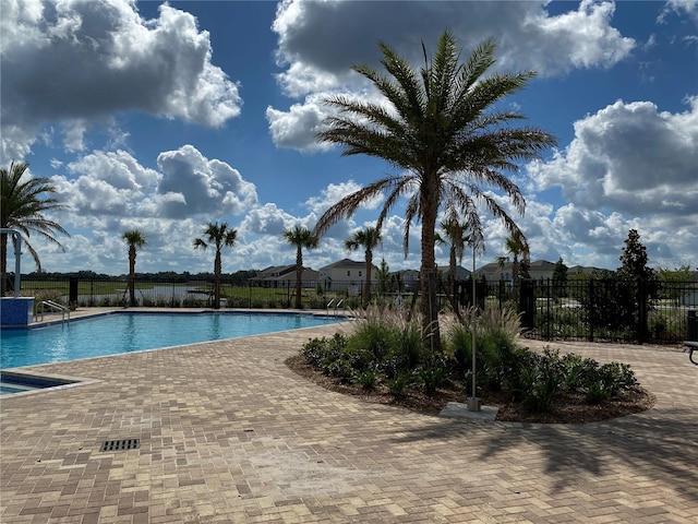 view of swimming pool with a patio area