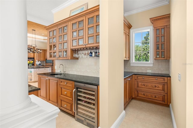 bar with wine cooler, sink, tasteful backsplash, and pendant lighting