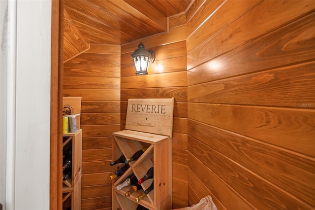 view of sauna with wooden walls and wooden ceiling