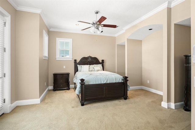 carpeted bedroom with ceiling fan and crown molding