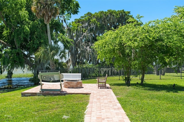 view of nearby features with a yard and an outdoor fire pit