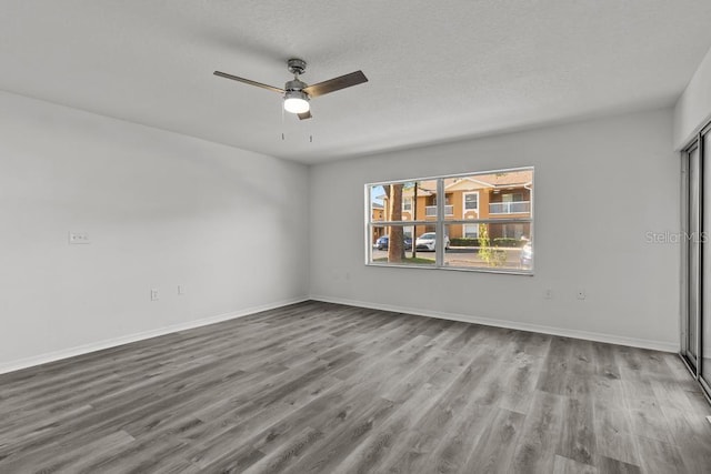 unfurnished room featuring ceiling fan, a textured ceiling, and light wood-type flooring