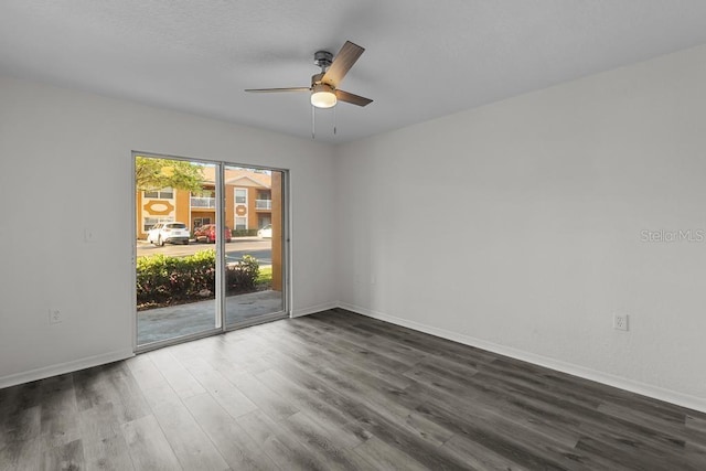 unfurnished room featuring dark hardwood / wood-style flooring and ceiling fan